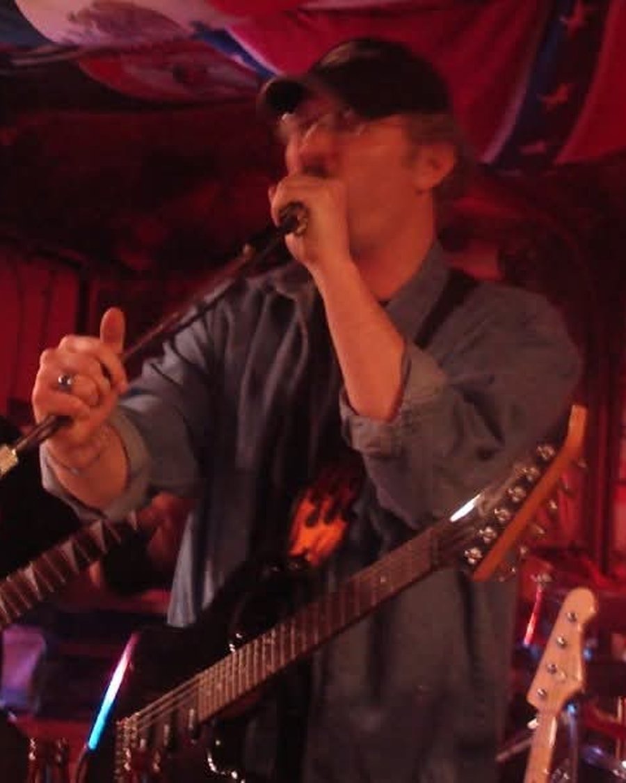 Mark McKechnie performing with a band