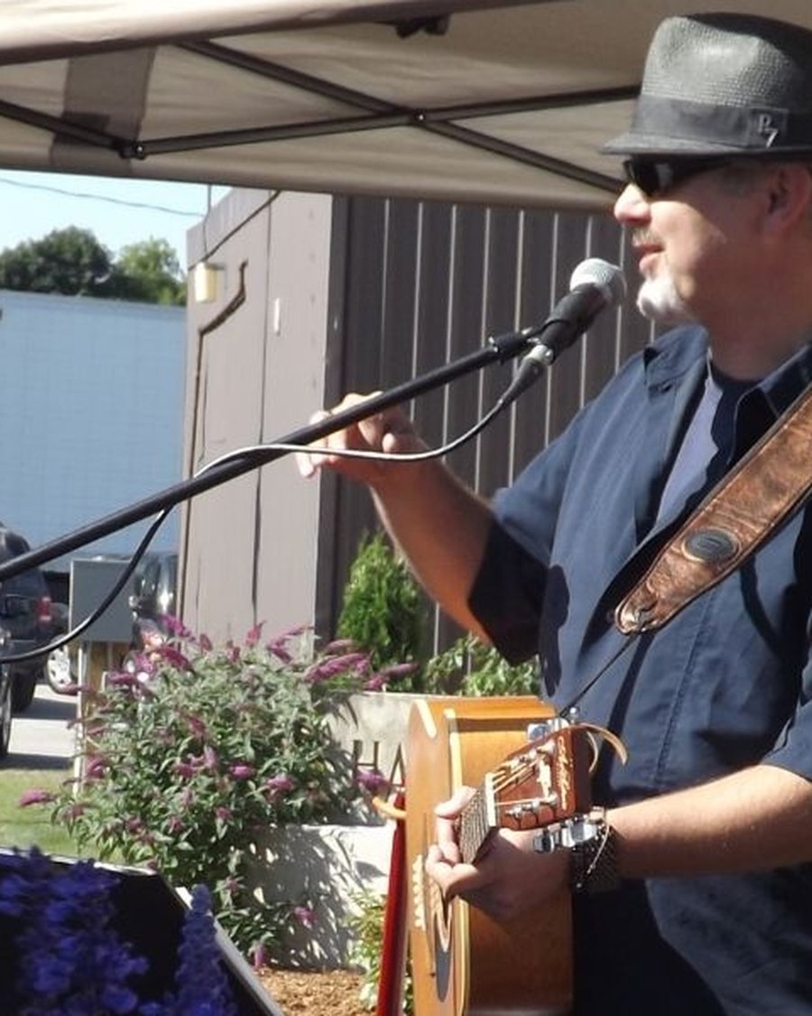 Mark McKechnie performing at a car show in Minto, Ontario