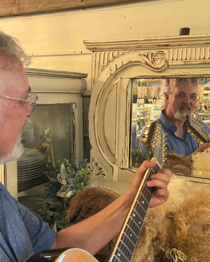 Mark McKechnie with his acoustic guitar